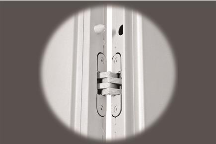The pedestrian door is standard constructed, in a central position with hidden hinges of high resistance